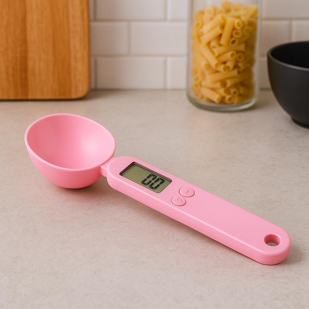 Pink NutriScoop Digital Measuring Spoon with smart display on kitchen counter.
